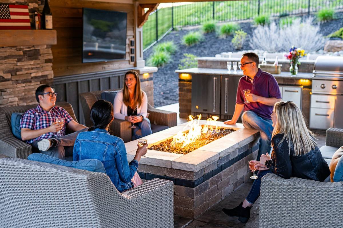 Side-by-side comparison of gas fire pit furniture sets showing material durability, BTU output, and seating comfort ratings