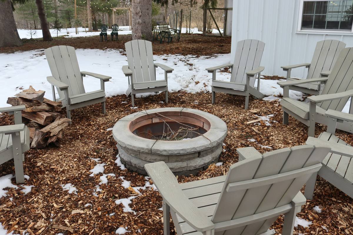 outdoor fire pit area diy showing anchored seating with steel bases on decomposed granite
